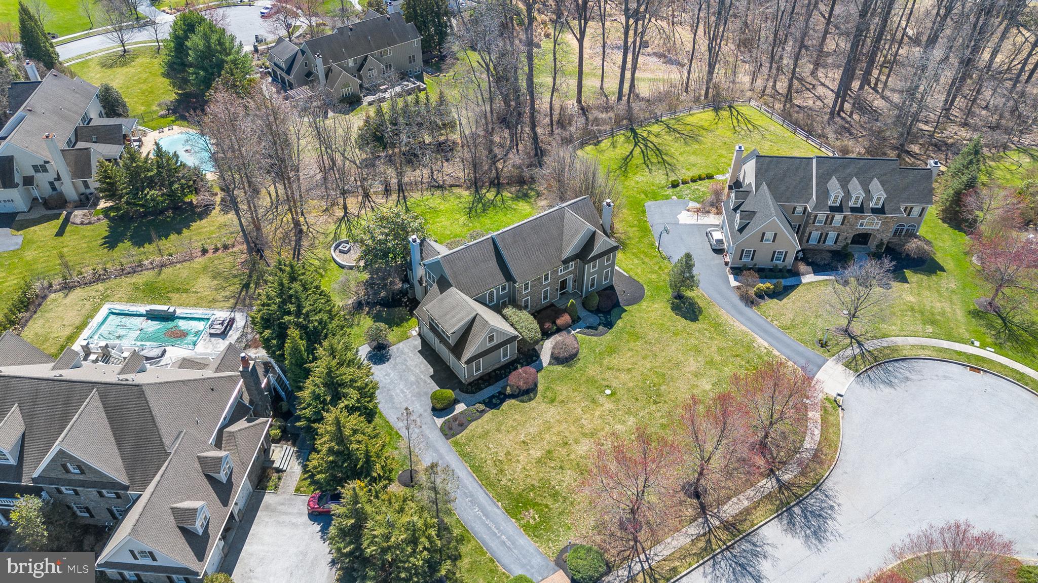 4 Greystone Circle Newtown Square, PA 19073 - Photo 46 of 51 an aerial view of a house with a yard and potted plants