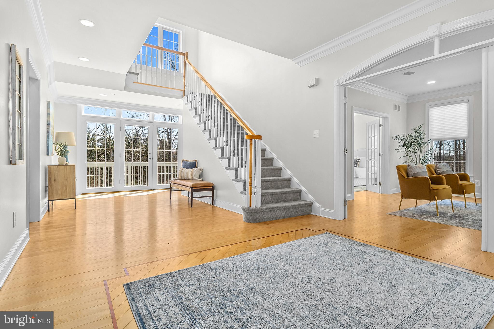 4 Greystone Circle Newtown Square, PA 19073 - Photo 5 of 51 a view of an entryway with floor to ceiling windows and kitchen view