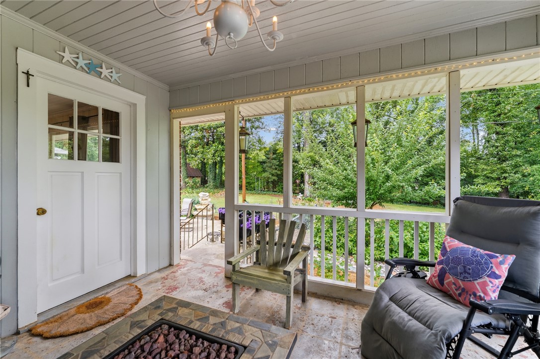 1105 Greenacres Anderson, SC 29621 - Photo 38 of 46 Relax outdoors in this private screened porch, featuring a tile floor and inviting fire pit.