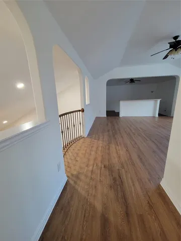 a bathroom with a sink mirror and shower