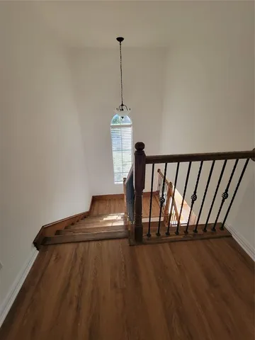 a view of entryway with wooden floor
