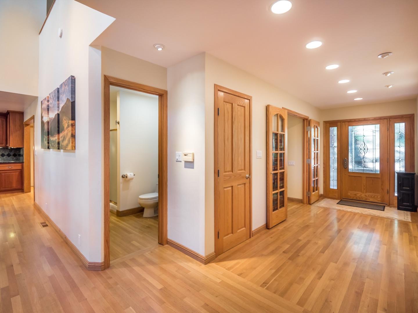 18635 Favre Ridge Road Los Gatos, CA 95033 - Photo 12 of 74 a view of a hallway with bathroom and wooden floor