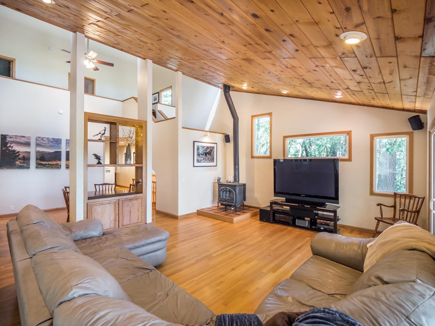 18635 Favre Ridge Road Los Gatos, CA 95033 - Photo 23 of 74 a living room with furniture and a flat screen tv