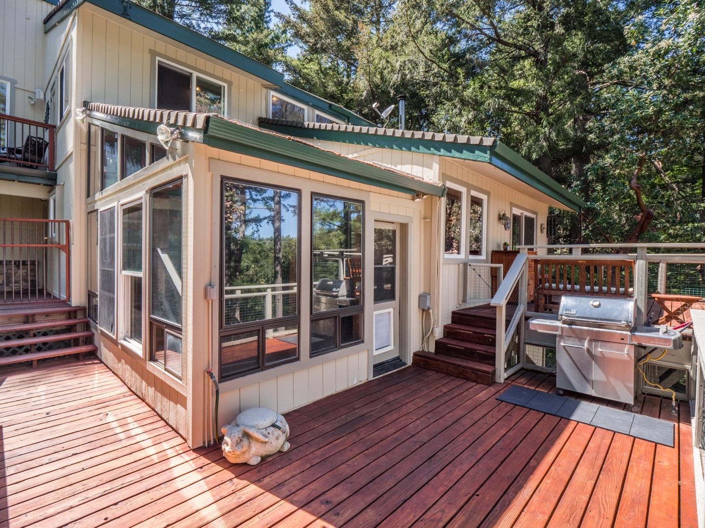 18635 Favre Ridge Road Los Gatos, CA 95033 - Photo 29 of 74 a view of a house with wooden deck and furniture