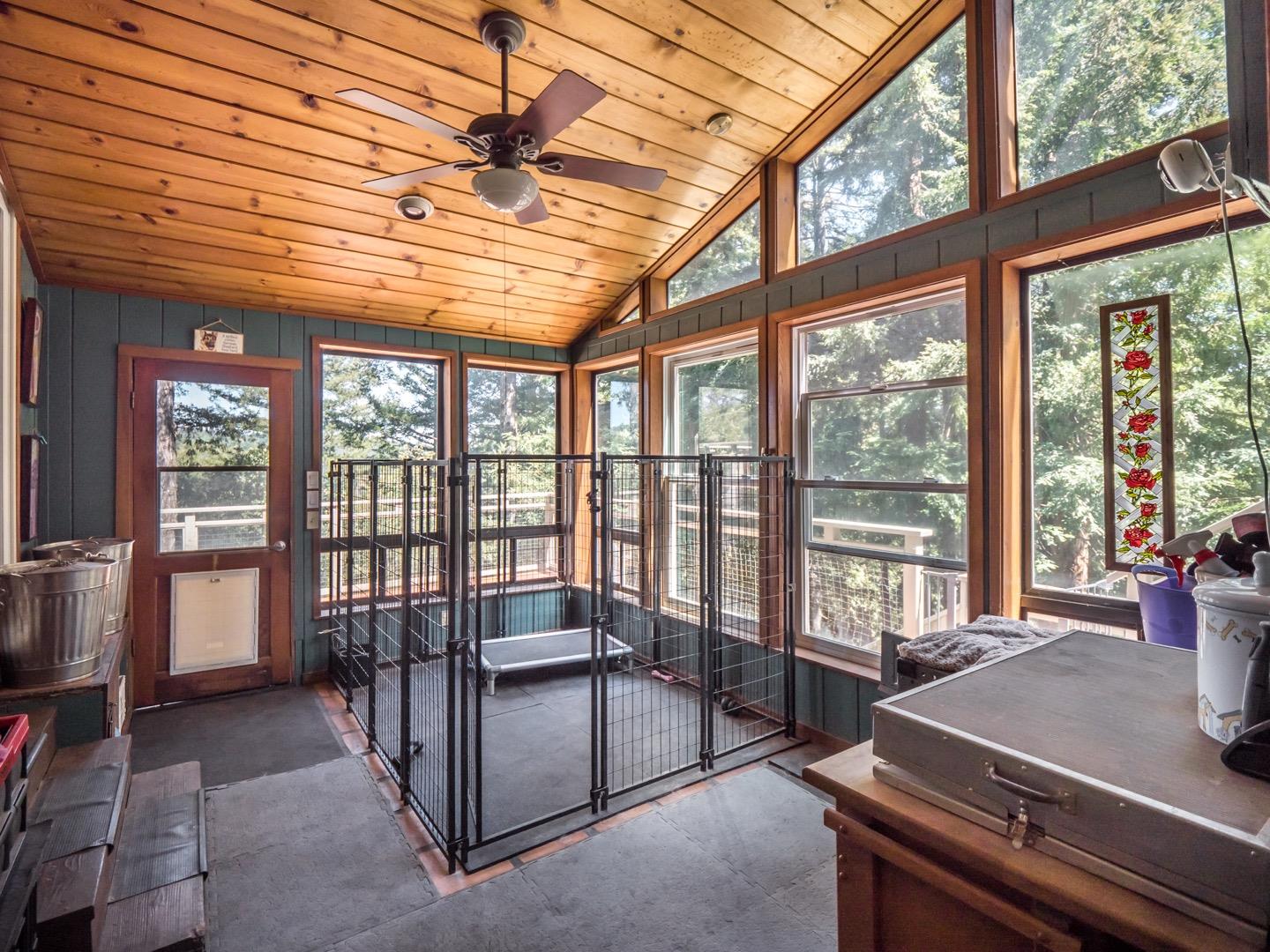 18635 Favre Ridge Road Los Gatos, CA 95033 - Photo 30 of 74 a bedroom with furniture and large windows