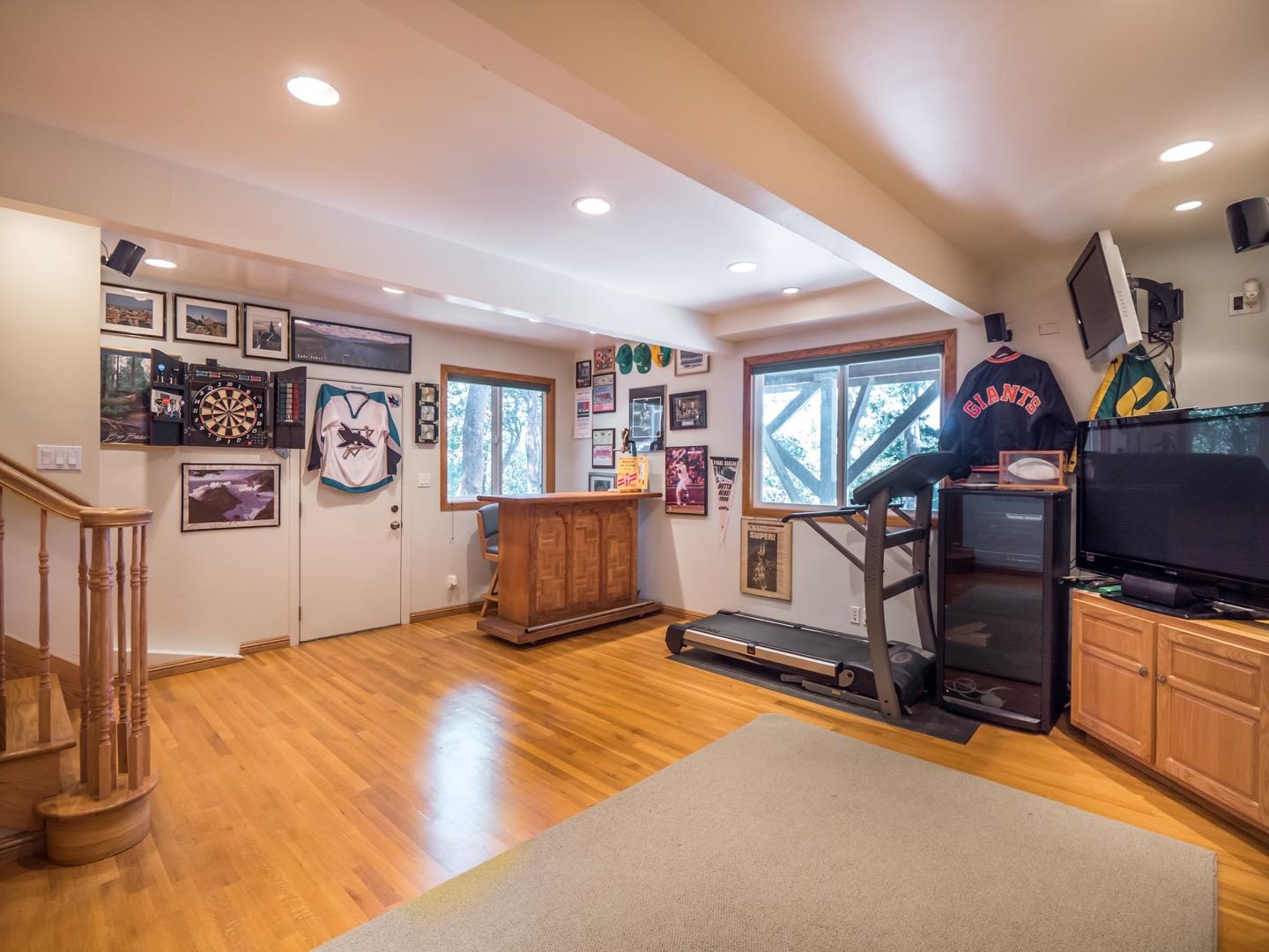 18635 Favre Ridge Road Los Gatos, CA 95033 - Photo 34 of 74 a view of a livingroom with furniture and a flat screen tv