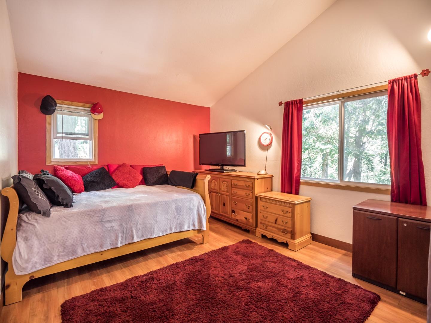 18635 Favre Ridge Road Los Gatos, CA 95033 - Photo 38 of 74 a bedroom with a bed and wooden floor