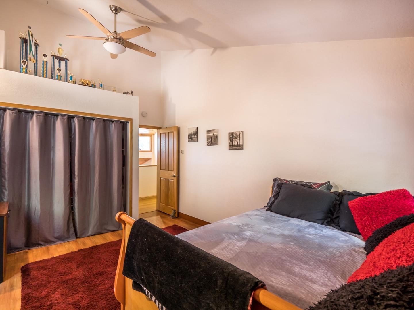 18635 Favre Ridge Road Los Gatos, CA 95033 - Photo 39 of 74 a bedroom with a bed and wooden floor