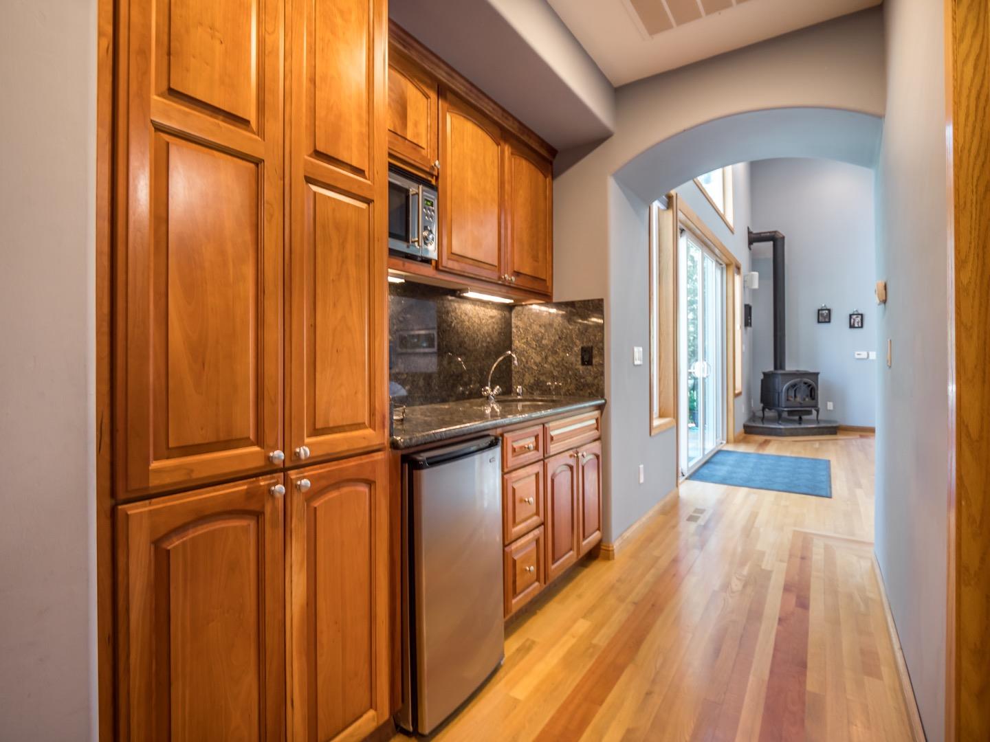18635 Favre Ridge Road Los Gatos, CA 95033 - Photo 41 of 74 a view of a hallway with wooden floor and staircase