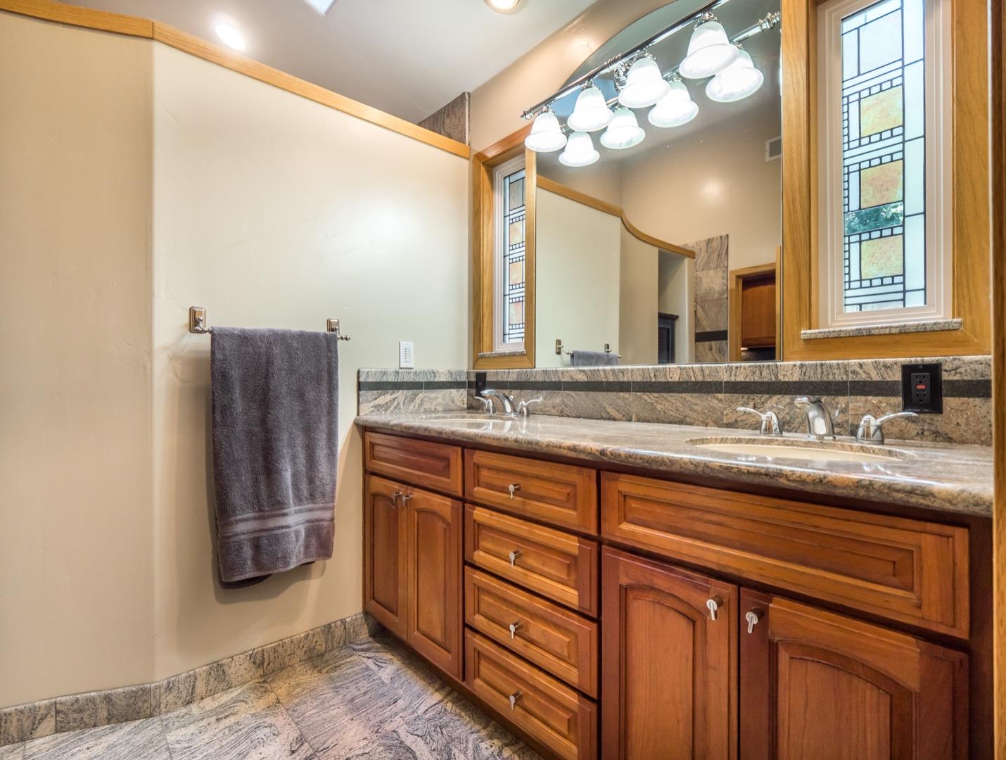 18635 Favre Ridge Road Los Gatos, CA 95033 - Photo 51 of 74 a bathroom with a sink and a mirror