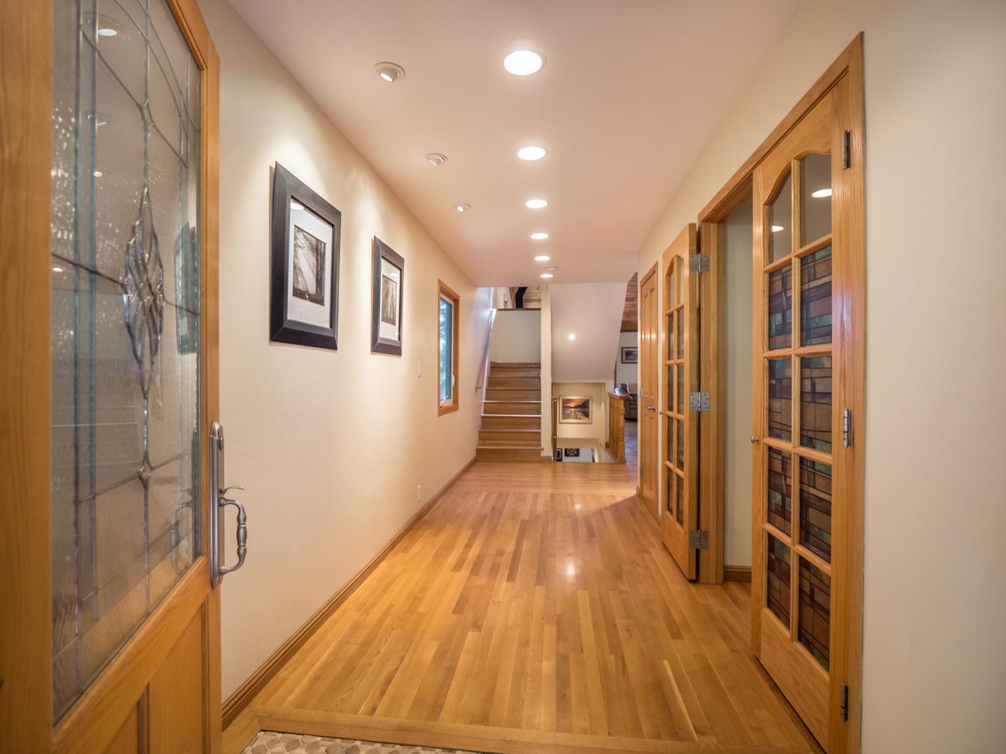 18635 Favre Ridge Road Los Gatos, CA 95033 - Photo 7 of 74 a view of a hallway with wooden floor