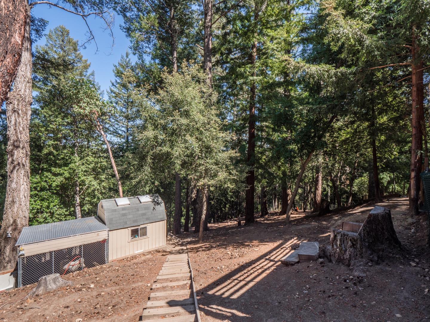 18635 Favre Ridge Road Los Gatos, CA 95033 - Photo 63 of 74 a backyard of a house with table and chairs