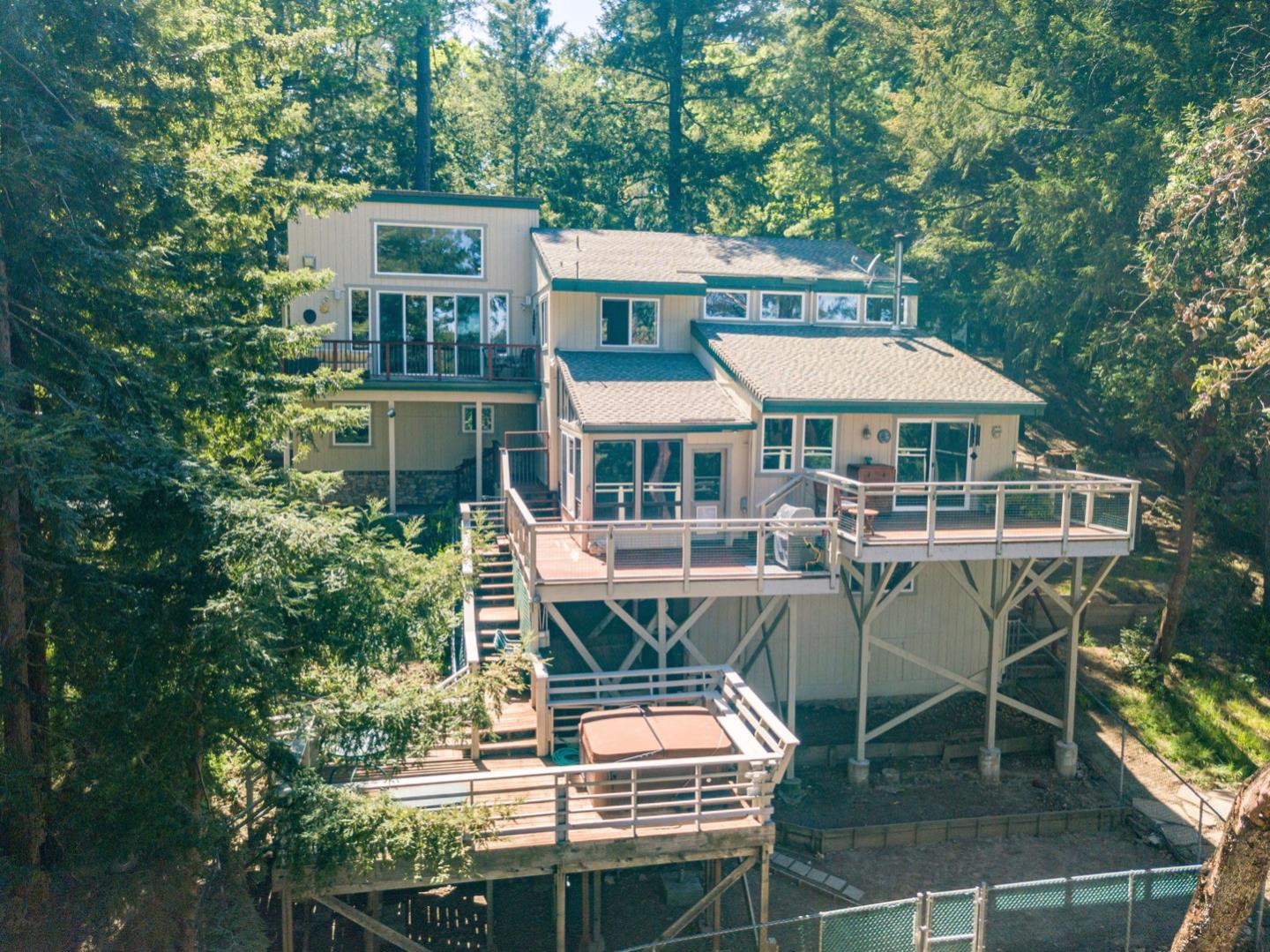 18635 Favre Ridge Road Los Gatos, CA 95033 - Photo 71 of 74 a view of a patio with a table and chairs and potted plants