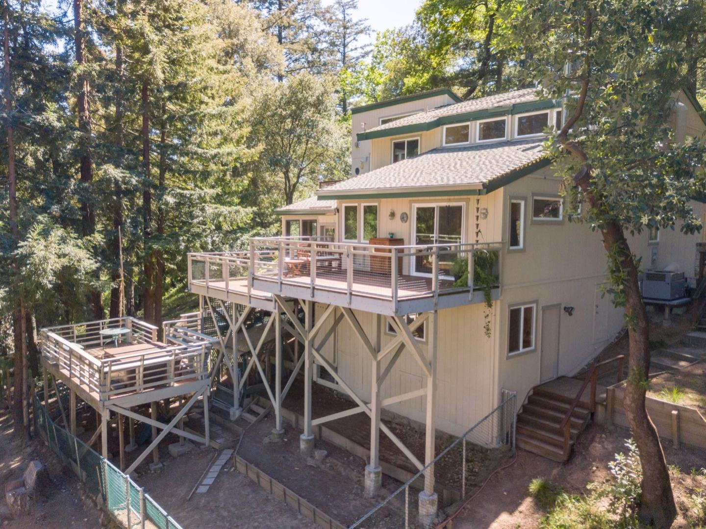 18635 Favre Ridge Road Los Gatos, CA 95033 - Photo 72 of 74 a view of a patio with table and chairs with wooden floor and fence