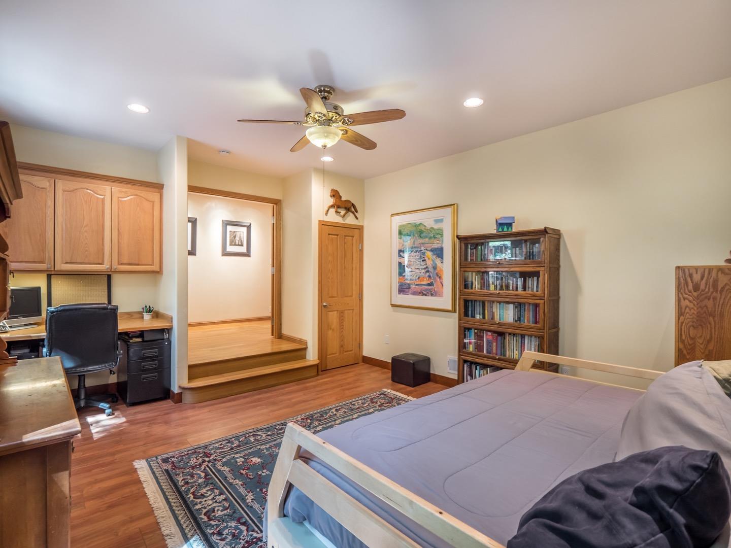 18635 Favre Ridge Road Los Gatos, CA 95033 - Photo 10 of 74 a bedroom with a bed and wooden floor