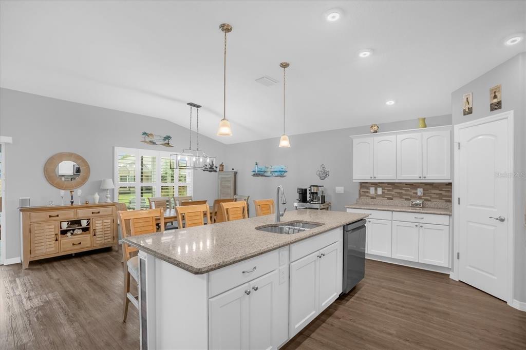 3782 Arlington Ridge Boulevard Leesburg, FL 34748 - Photo 11 of 52 a kitchen with a sink stove and cabinets