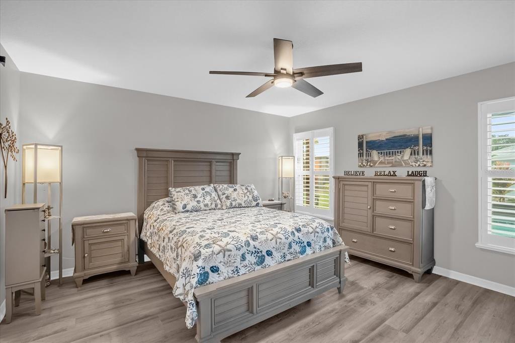 3782 Arlington Ridge Boulevard Leesburg, FL 34748 - Photo 13 of 52 a bedroom with a bed and a window