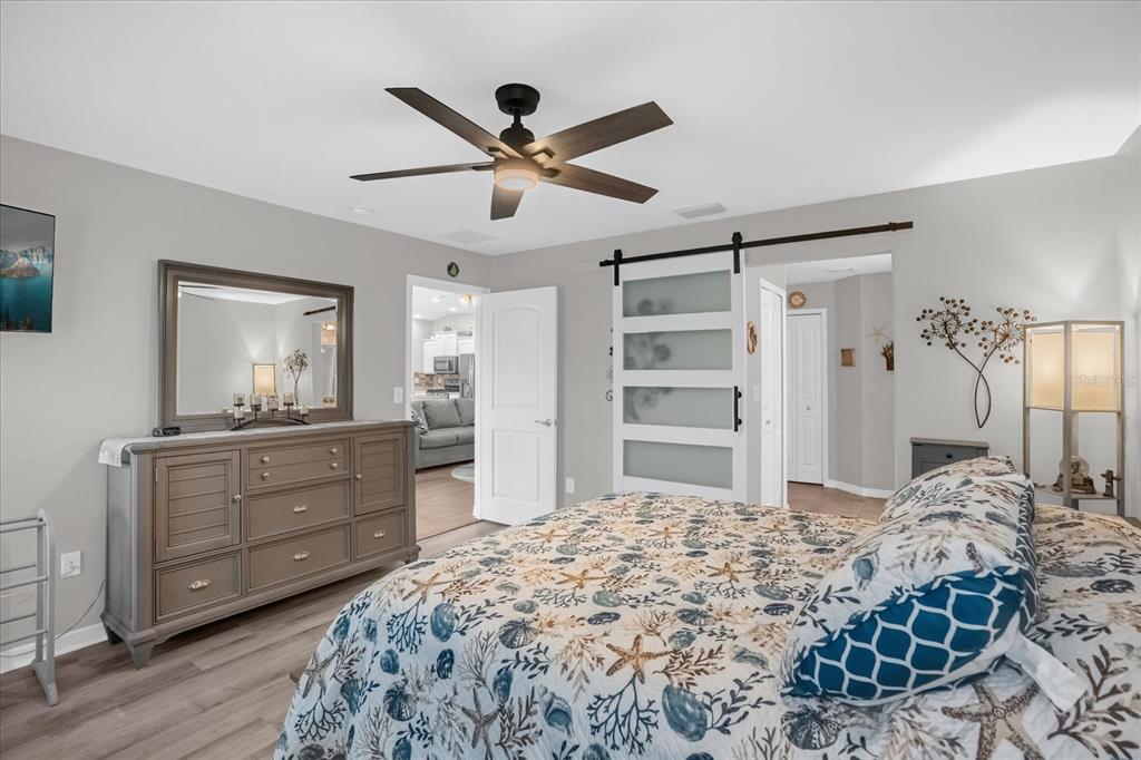 3782 Arlington Ridge Boulevard Leesburg, FL 34748 - Photo 14 of 52 a bedroom with a bed and a dresser