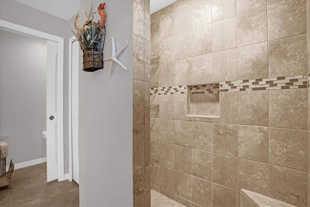 3782 Arlington Ridge Boulevard Leesburg, FL 34748 - Photo 16 of 52 a bathroom with a shower and a sink