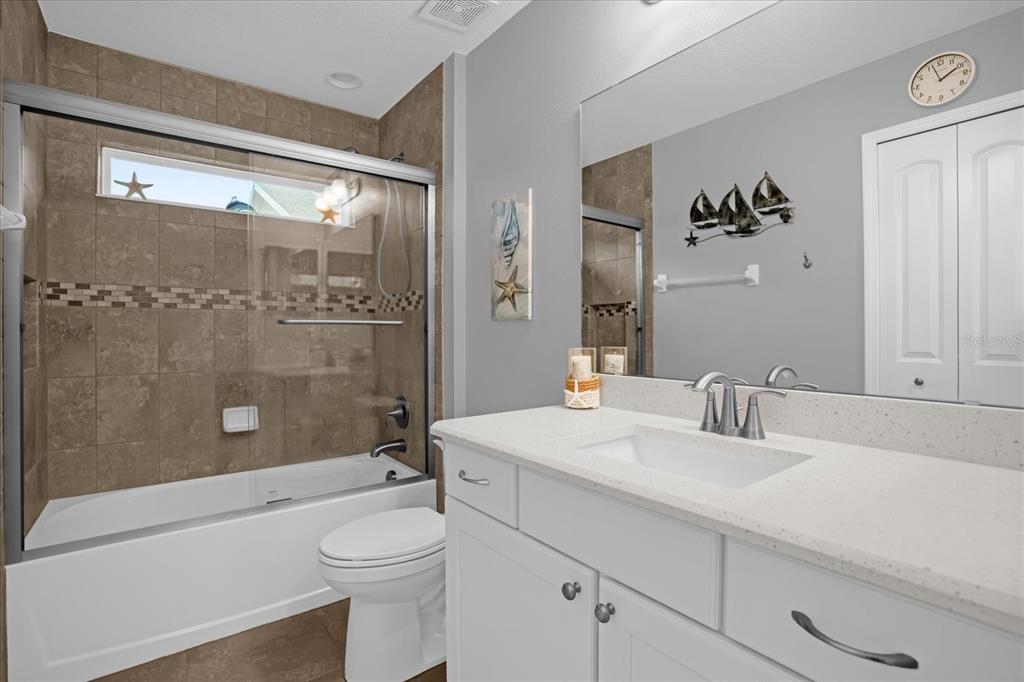 3782 Arlington Ridge Boulevard Leesburg, FL 34748 - Photo 18 of 52 a bathroom with a sink a toilet and shower