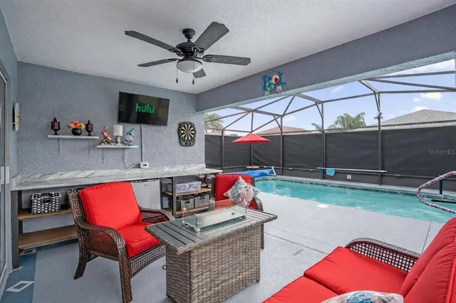 a swimming pool with outdoor seating