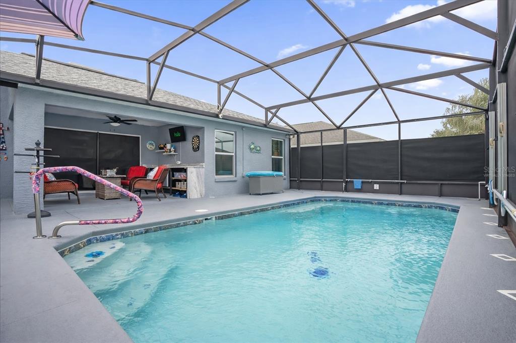 3782 Arlington Ridge Boulevard Leesburg, FL 34748 - Photo 22 of 52 a swimming pool with outdoor seating