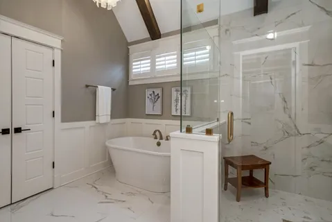 a spacious bathroom with sink and mirror