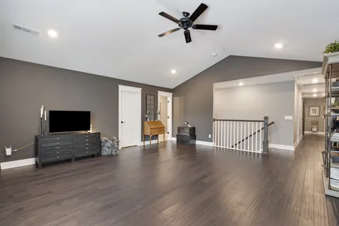 a view of livingroom with furniture wooden floor and windows