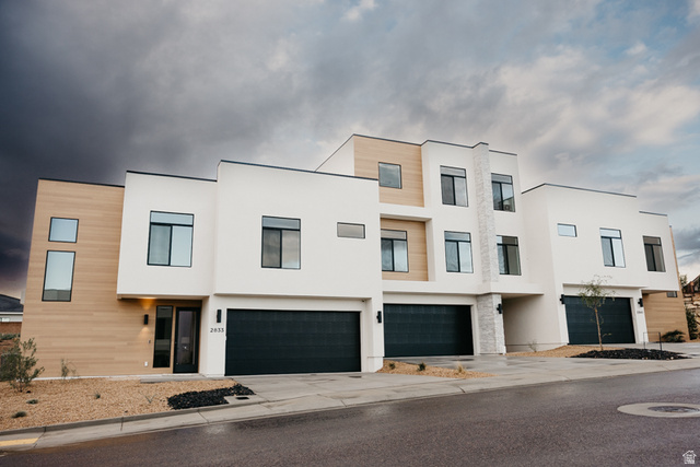 2759 Becco Trail, Unit 16 St. George, UT 84770 - Photo 1 of 42 Contemporary home featuring stucco siding, concrete driveway, and an attached garage