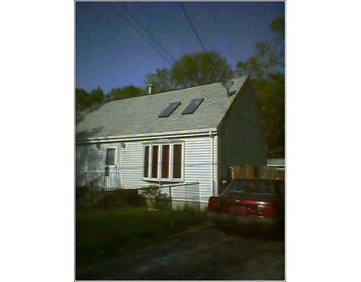 235 Gresham Street Springfield, MA 01119 - Photo 2 of 7 a front view of a house with a yard