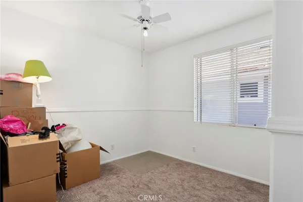 a view of storage and utility room with a window