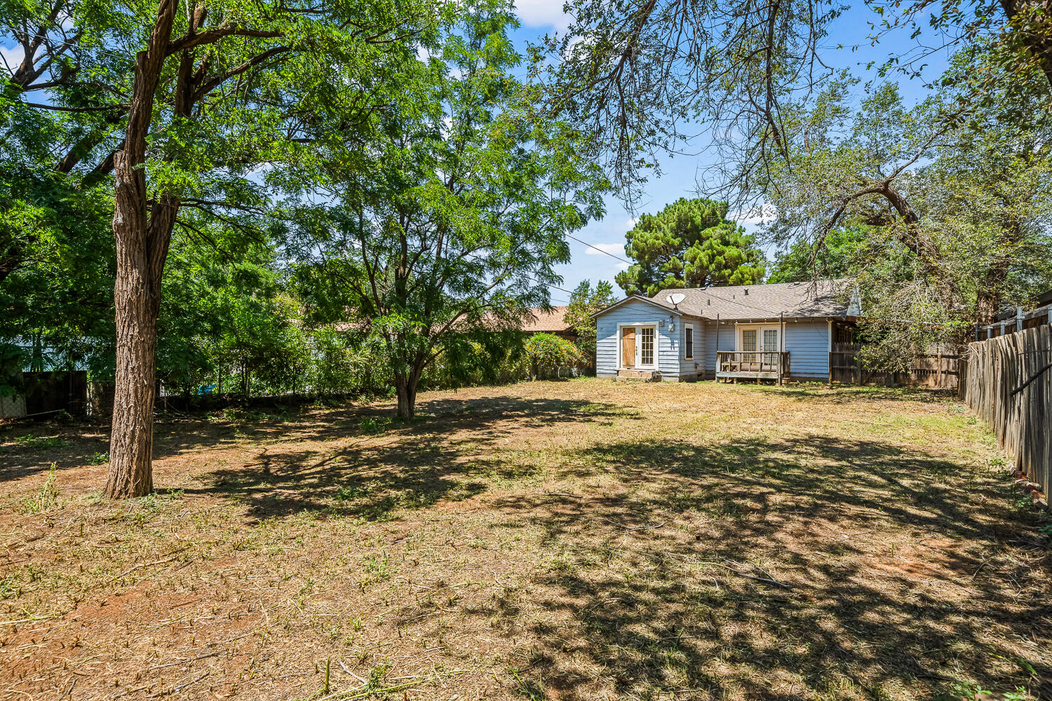 2313 20th Street Lubbock, TX 79411 - Photo 19 of 21 a house with trees in front of it