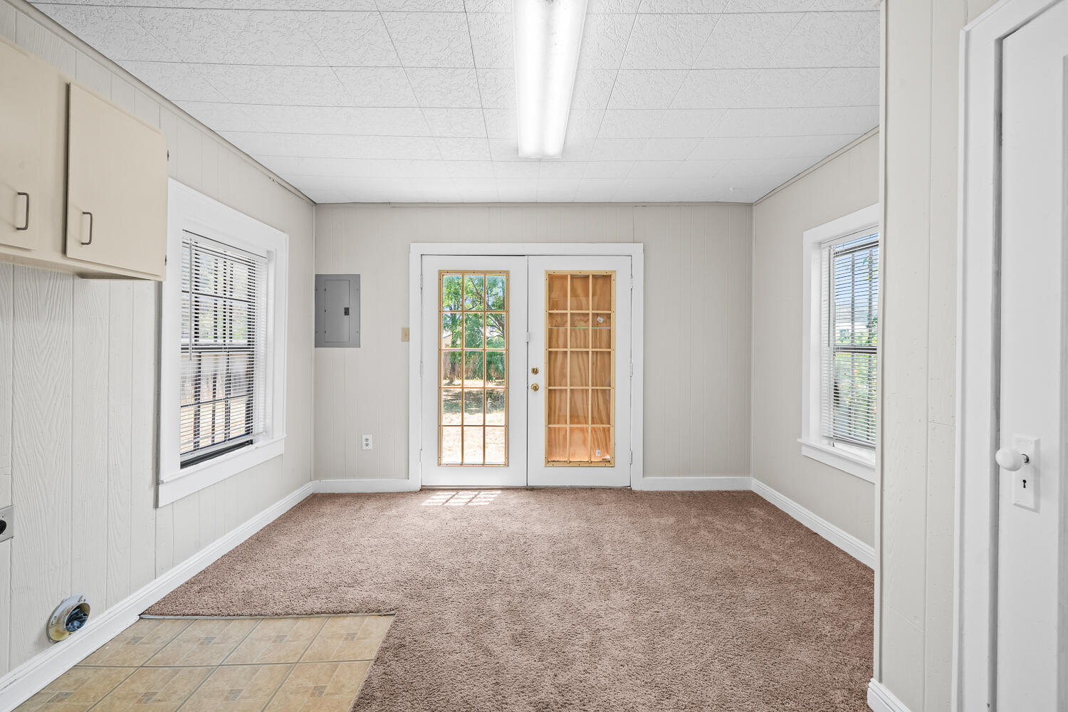 2313 20th Street Lubbock, TX 79411 - Photo 10 of 21 a view of an empty room with a window