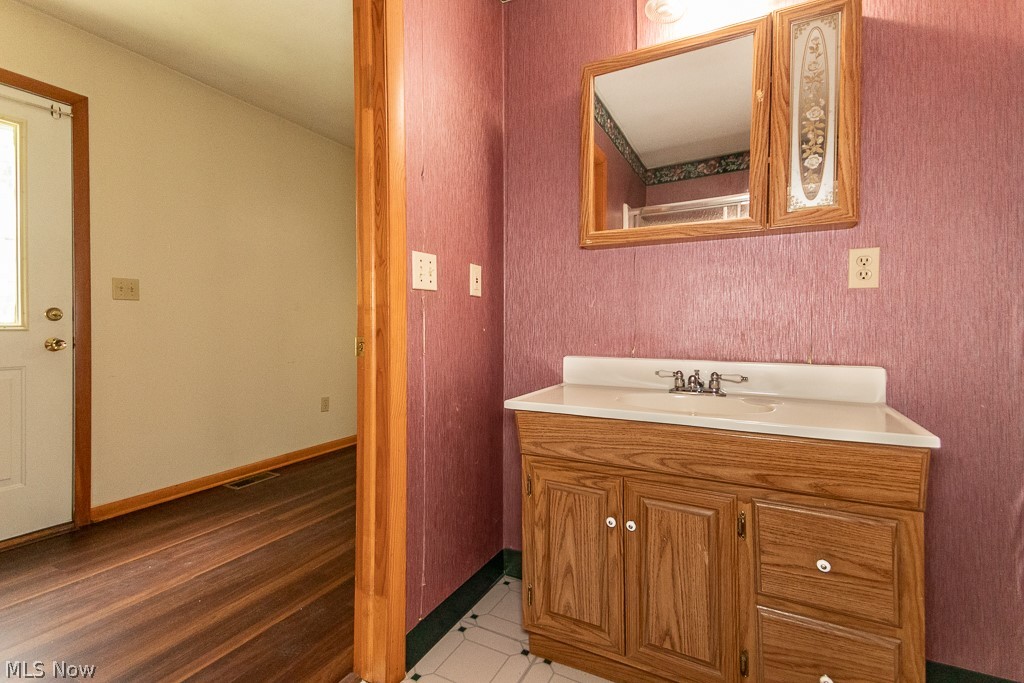 4517 Mackall Road Cleveland, OH 44121 - Photo 28 of 41 Bathroom with vanity and tile patterned flooring