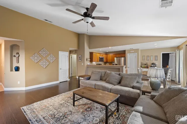 a living room with furniture and a rug