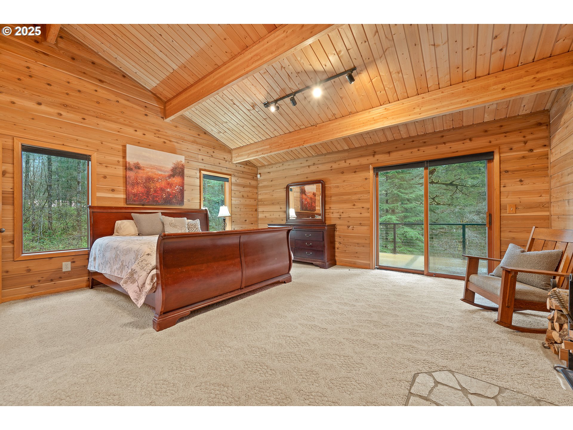1261 Mathews Road Washougal, WA 98671 - Photo 12 of 42 a spacious bedroom with a bed and large windows