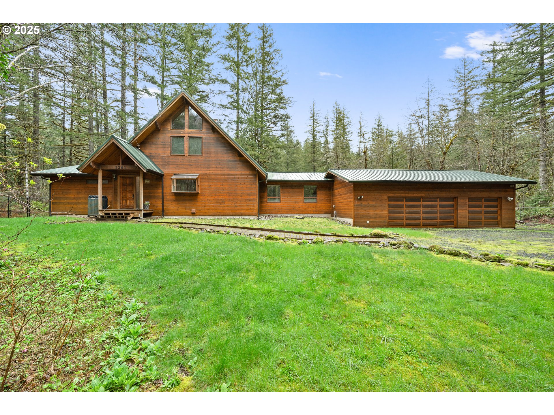 1261 Mathews Road Washougal, WA 98671 - Photo 2 of 42 a view of a house with a yard
