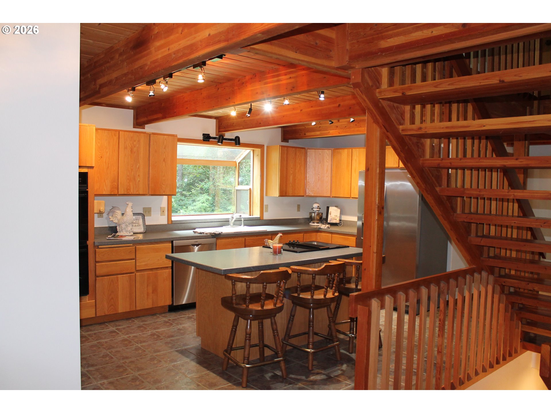 1261 Mathews Road Washougal, WA 98671 - Photo 36 of 42 a kitchen with a sink a counter top space and stainless steel appliances