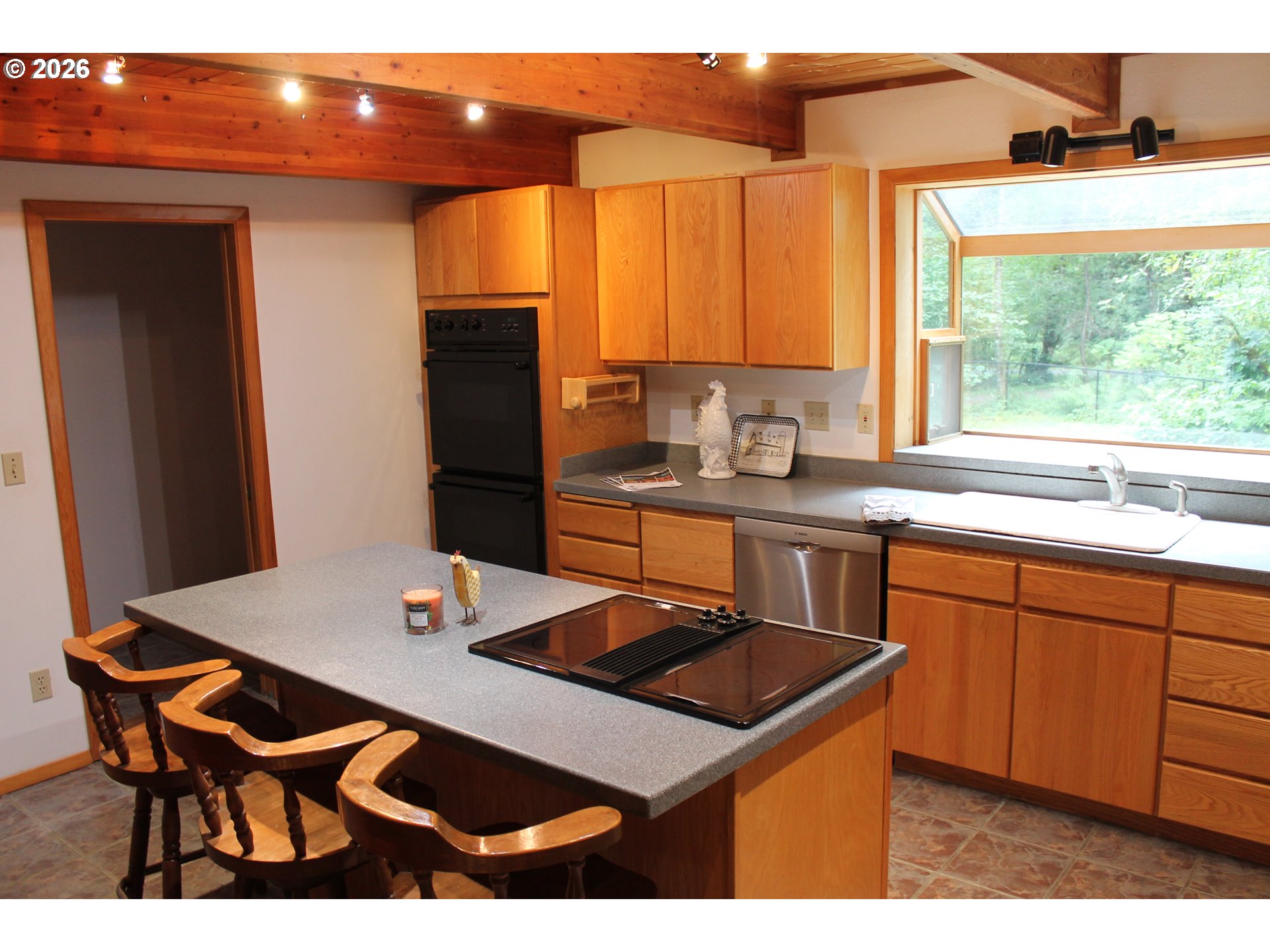 1261 Mathews Road Washougal, WA 98671 - Photo 40 of 42 a kitchen with stainless steel appliances granite countertop a sink a stove and refrigerator
