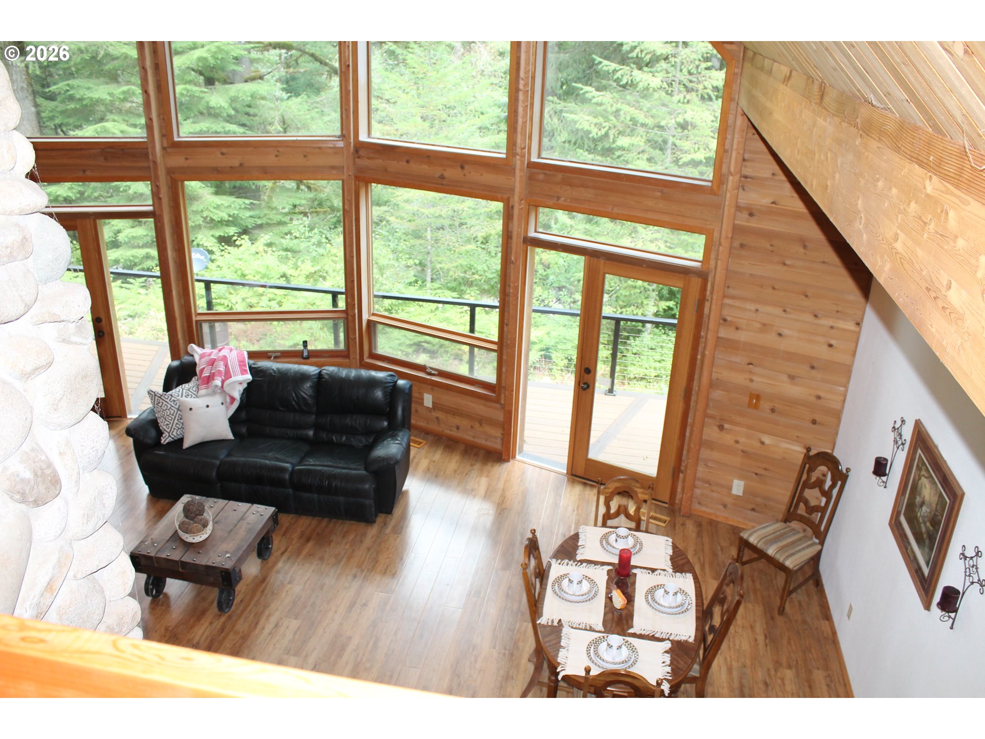 1261 Mathews Road Washougal, WA 98671 - Photo 41 of 42 a living room with furniture and a floor to ceiling window