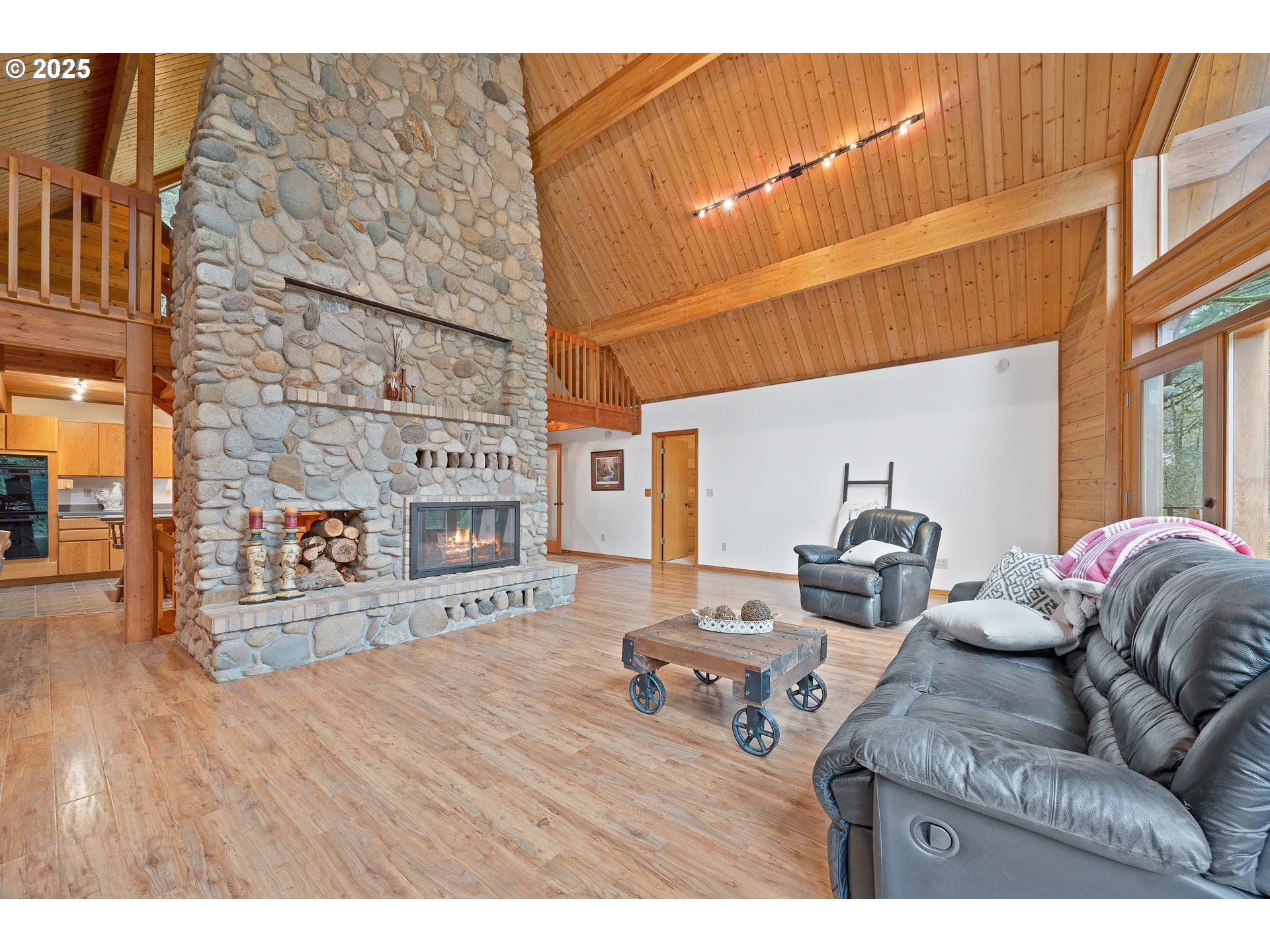 1261 Mathews Road Washougal, WA 98671 - Photo 10 of 42 a living room with furniture a fireplace and wooden floor