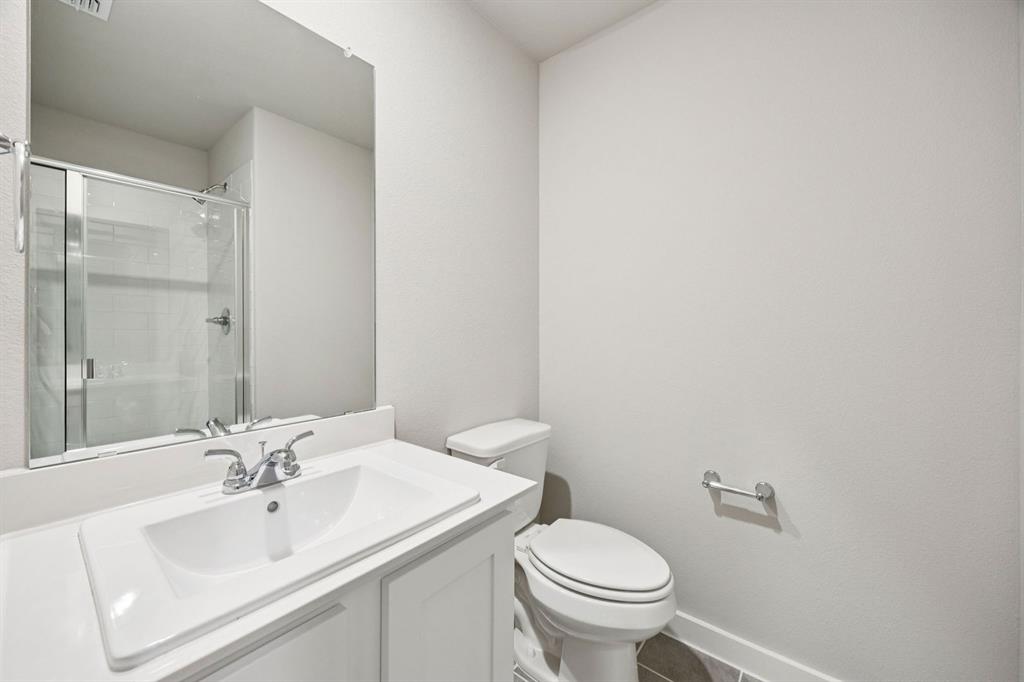 2206 Currents Road Princeton, TX 75407 - Photo 24 of 27 a bathroom with a sink and a toilet