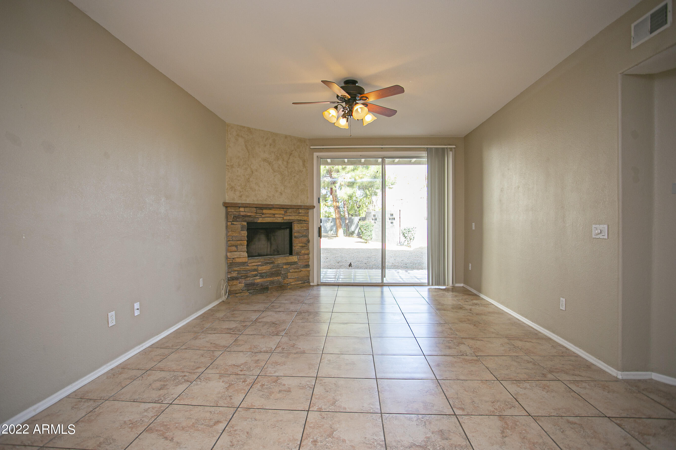 7101 West Beardsley Road, Unit 821 Glendale, AZ 85308 - Photo 11 of 28 Living Room with wood burning fireplace