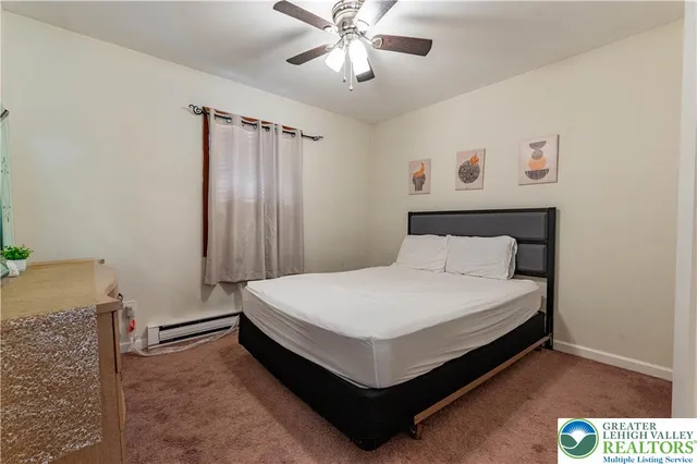 a bed room with a bed and a chandelier