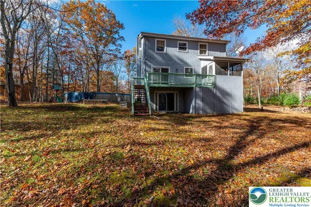 a view of house with yard