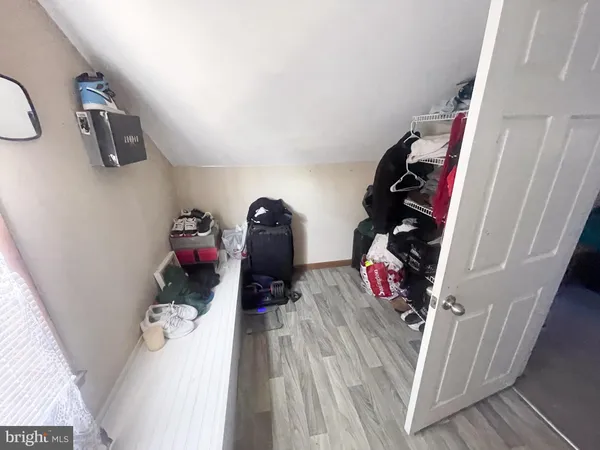 a room with pool table and a chair