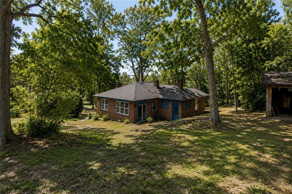 203 Church Street Northeast Rome, GA 30161 - Photo 34 of 40 a big house with large trees and plants