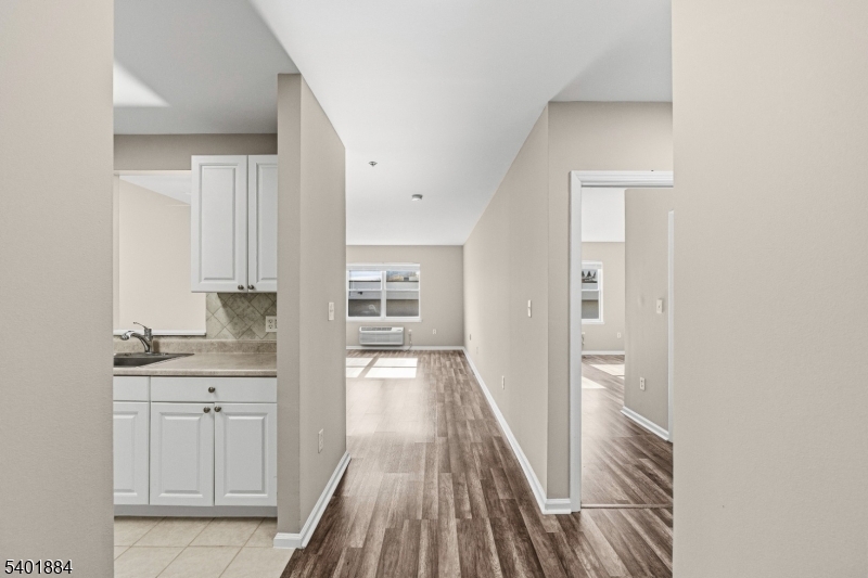 905 River Road, Unit 224 Edgewater, NJ 07020 - Photo 13 of 14 a view of a kitchen from the hallway