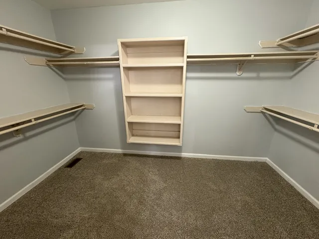 a view of an empty walk in closet