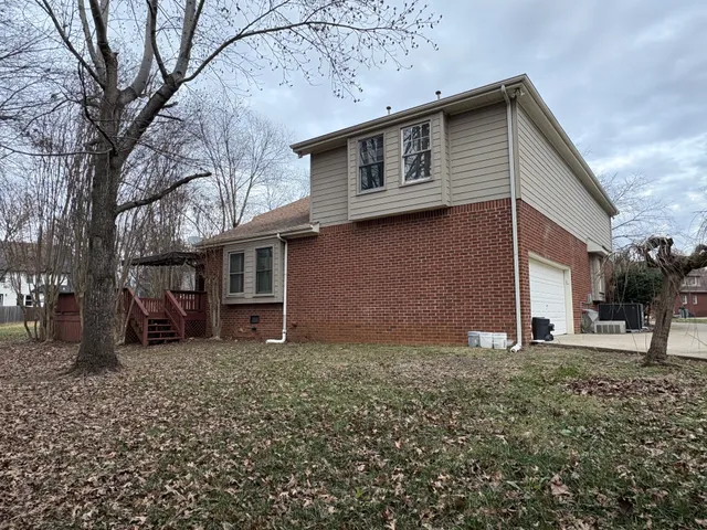a view of outdoor space with wooden floor